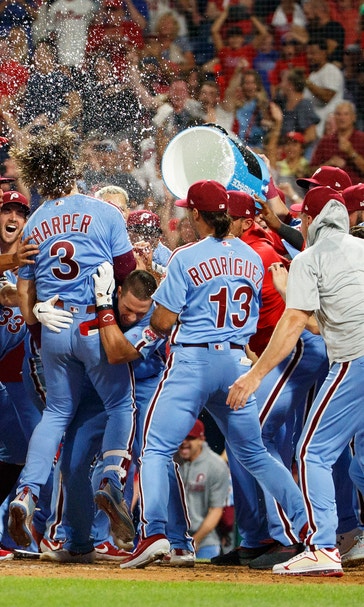 Harper hits grand slam in 9th, Phillies rally past Cubs 7-5
